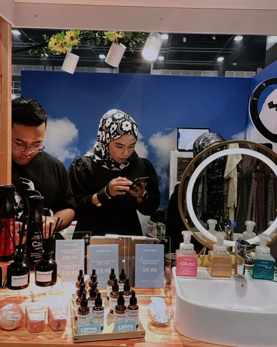 Visitors browsing the Rainfresh booth, June 2025