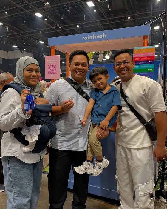 A family at the Rainfresh booth at Twilight, June 2025