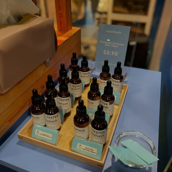 A tray of Rainfresh perfume oil testers at a pop-up booth